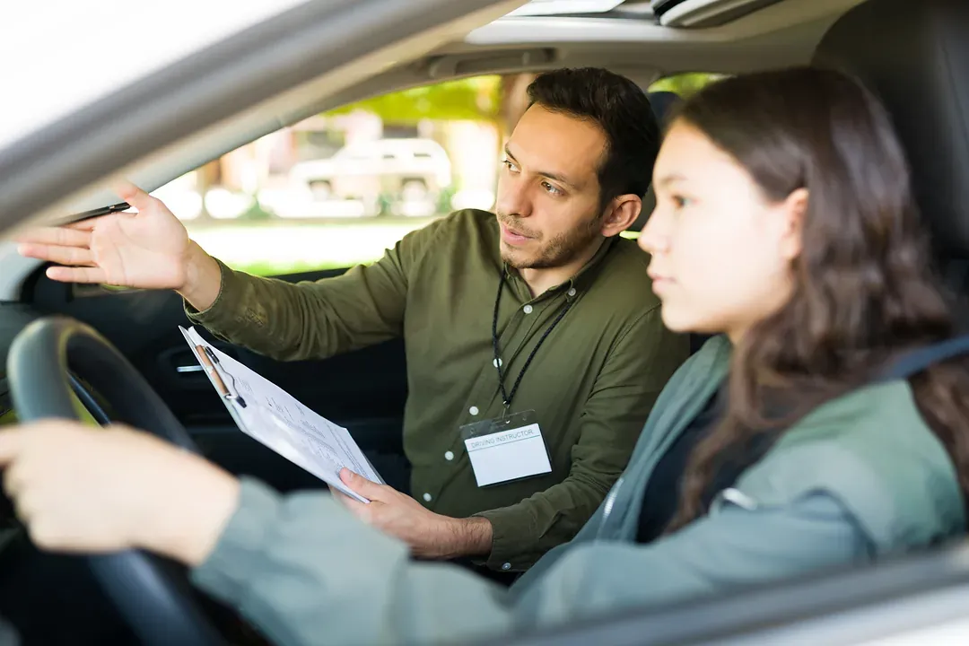 A driving instructor talking a learner through a manoeuvre