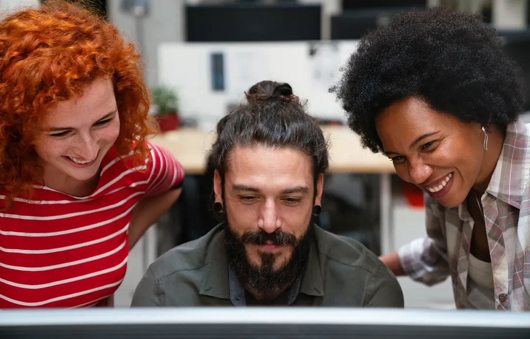 A team of professionals in a meeting around an office table